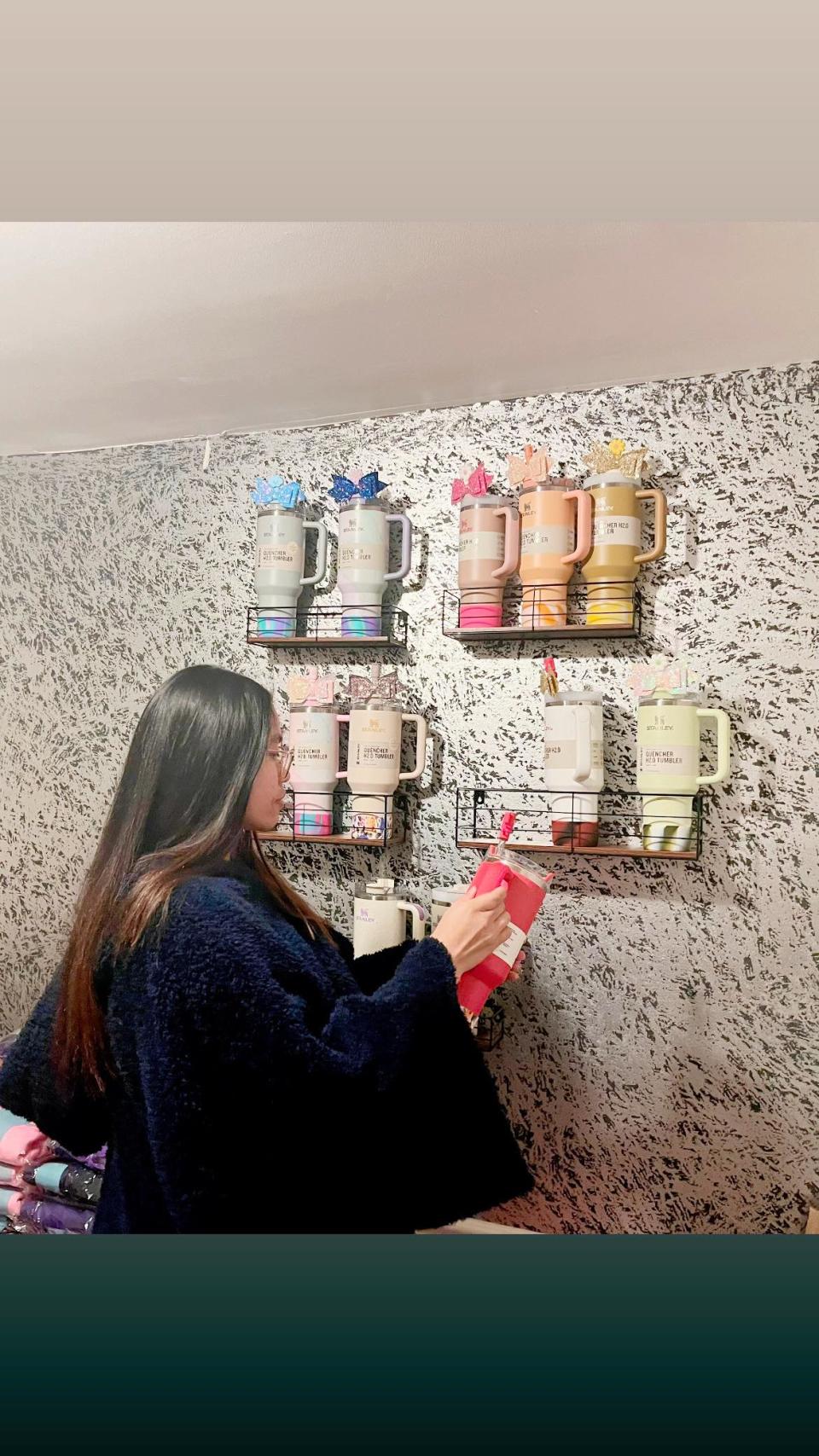 Flora Casta of North Carolina with her Stanley cup collection.