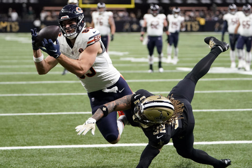 Chicago Bears tight end Cole Kmet (85) makes a touchdown catch over New Orleans Saints safety Tyrann Mathieu (32) during the first half of an NFL football game in New Orleans, Sunday, Nov. 5, 2023. (AP Photo/Gerald Herbert)