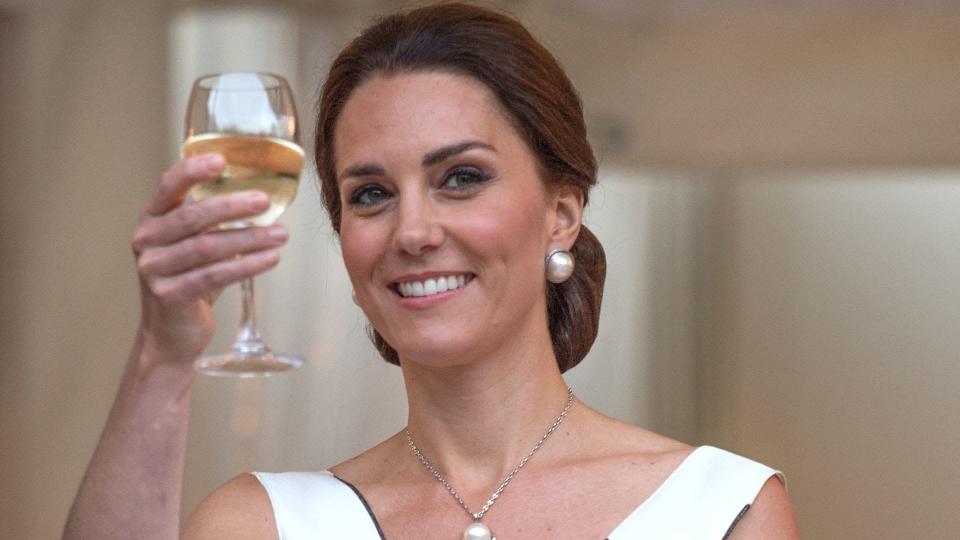 Princess Kate takes part in a toast as she attends the Queen's Birthday Garden Party at the Orangeryeduring an official visit to Poland and Germany on July 17, 2017 in Warsaw, Poland. 