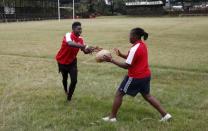 Kenya Women's Rugby team player Camilla Cynthia and Shilla Chajira attend a light training session at the RFUEA grounds in the capital Nairobi, April 4, 2016. REUTERS/Thomas Mukoya