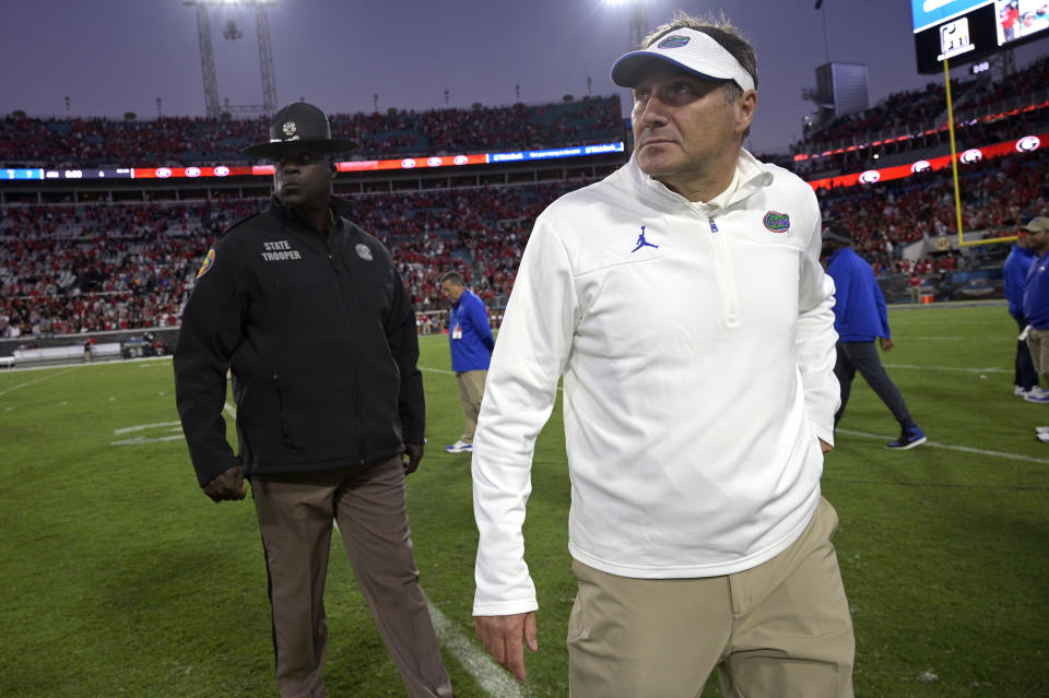 Florida head coach Dan Mullen walks off the field after a loss to Georgia in an NCAA college football game, Saturday, Oct. 30, 2021, in Jacksonville, Fla. (AP Photo/Phelan M. Ebenhack)