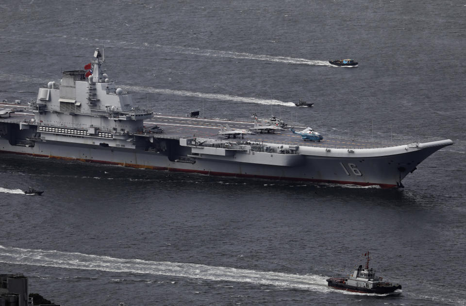 FILE - In this July 7, 2017, file photo, the Liaoning, China's first aircraft carrier, sails into Hong Kong for a port call to celebrate the 20th anniversary of the People's Liberation Army (PLA) garrison's presence in the semi-autonomous Chinese city and former British colony. (AP Photo/Vincent Yu, File)