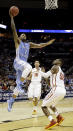 North Carolina's Leslie McDonald (2) goes up for a shot as Iowa State's DeAndre Kane (50) defends during the first half of a third-round game in the NCAA college basketball tournament Sunday, March 23, 2014, in San Antonio. (AP Photo/David J. Phillip)