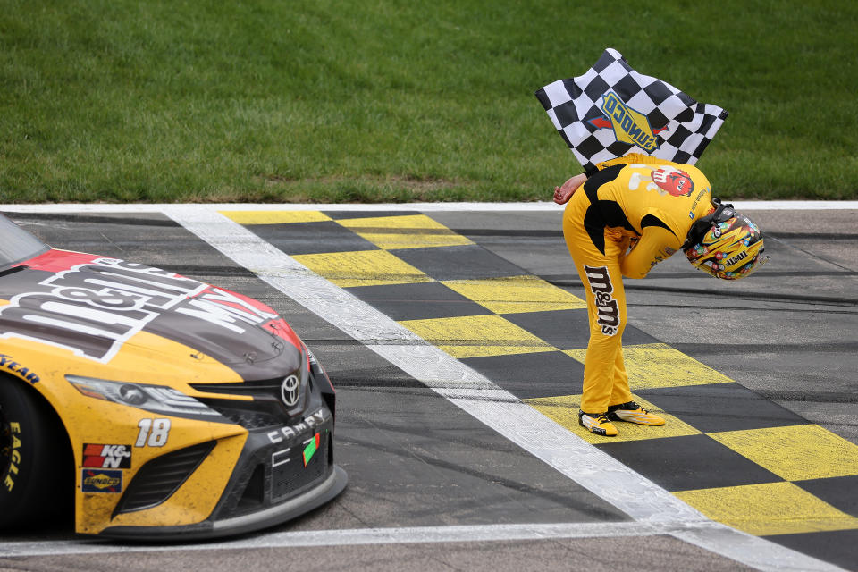 KANSAS CITY, KANSAS - MAY 02: Kyle Busch, driver of the #18 M&M's Mix Toyota, takes a bow after winning the NASCAR Cup Series Buschy McBusch Race 400 at Kansas Speedway on May 02, 2021 in Kansas City, Kansas. (Photo by James Gilbert/Getty Images)