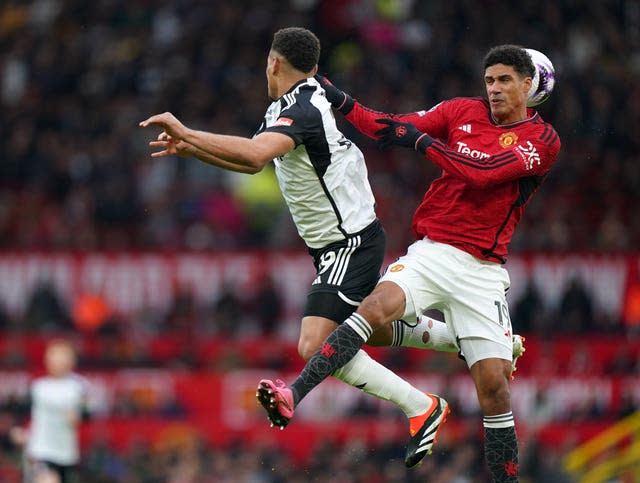 Rodrigo Muniz and Raphael Varane battle for the ball 