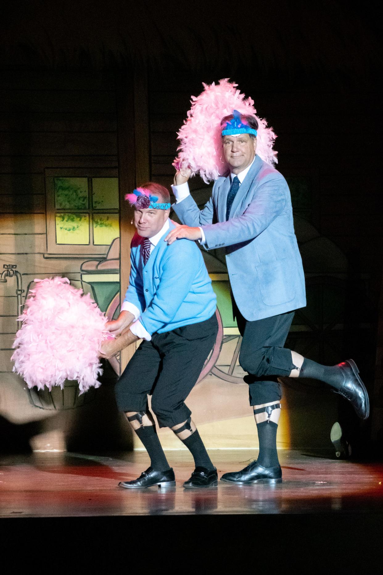 Jim Whitehair, left, and Brent Miller perform the iconic sisters song from "White Christmas," complete with feathers and sock garters. The show runs at 7 p.m. on Friday and Saturday and at 2 p.m. on Sunday at the Pritchard Laughlin Civic Center. Tickets are $12  and can be reserved by calling 740-439-7009. For more photos visit www.daily-jeff.com