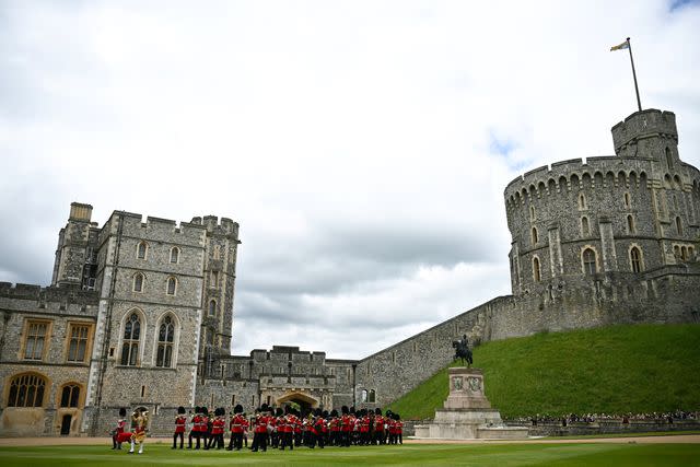 <p>Ben Stansall - WPA Pool/Getty</p> King Charles presents new colours to the Irish Guards at Windsor Castle on June 10, 2024