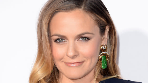 Alicia Silverstone Strips for PETA's 