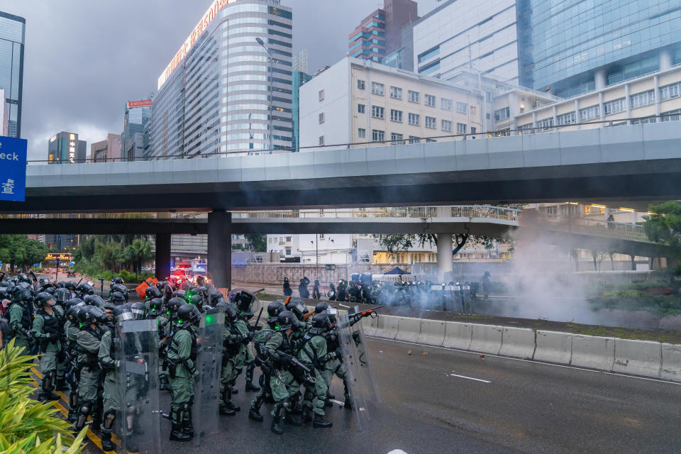 HONG KONG, CHINA - AUGUST 31: Riot police aim with tear gas launchers during a clash outside the government headquarters on August 31, 2019 in Hong Kong, China. Pro-democracy protesters have continued demonstrations across Hong Kong since 9 June against a controversial bill which allows extraditions to mainland China as the ongoing protests surpassed the Umbrella Movement five years ago, becoming the biggest political crisis since Britain handed its onetime colony back to China in 1997. Hong Kong's embattled leader Carrie Lam apologized for introducing the bill and declared it "dead", however the campaign continues to draw large crowds to voice their discontent while many end up in violent clashes with the police as protesters show no signs of stopping. (Photo by Billy H.C. Kwok/Getty Images)