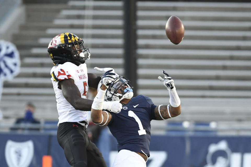 Penn State safety Jaquan Brisker (1) breaks up a pass intended for Maryland wide receiver Rakim Jarrett (5) in the second quarter of an NCAA college football game in State College, Pa., Saturday, Nov. 7, 2020. (AP Photo/Barry Reeger)