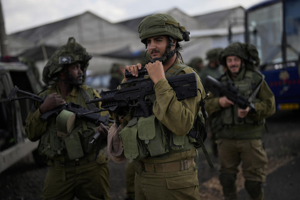 Israeli soldiers patrol a road near the border between Israel and Lebanon, Monday, Oct. 16, 2023. (AP Photo/Francisco Seco)