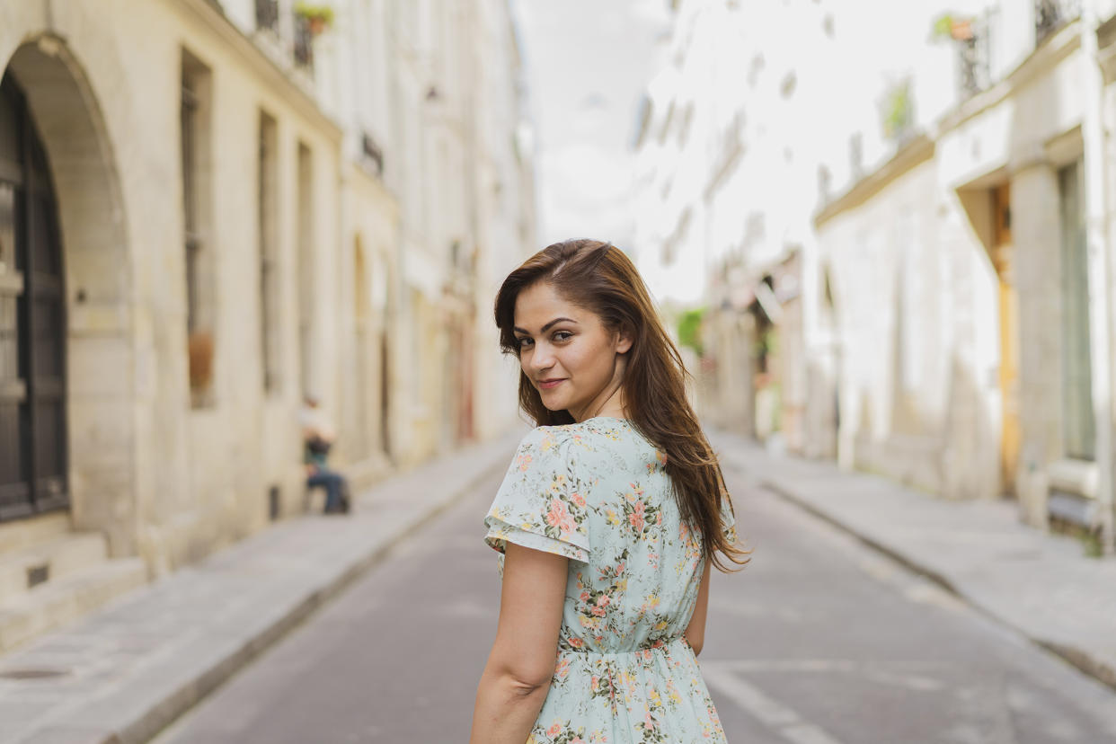 Smiling woman standing on street