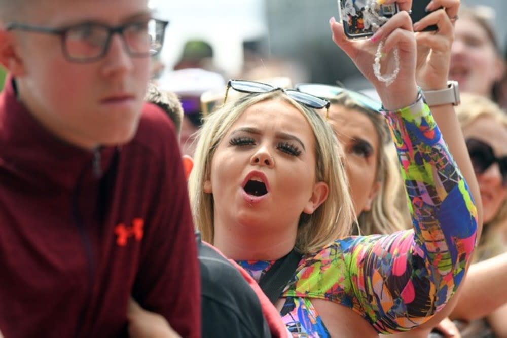 A woman sings along at Trnsmt