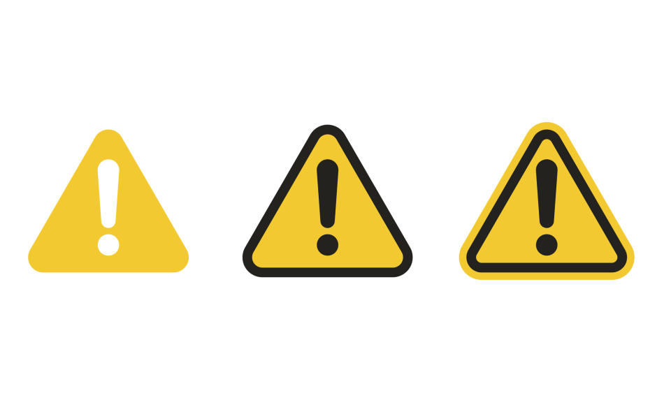 Three yellow triangular signs with black exclamation points