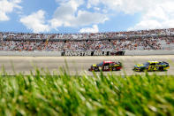 DOVER, DE - JUNE 03: Clint Bowyer, driver of the #15 5-hour Energy Toyota, leads Matt Kenseth, driver of the #17 Best Buy Ford, during the NASCAR Sprint Cup Series FedEx 400 benefiting Autism Speaks at Dover International Speedway on June 3, 2012 in Dover, Delaware. (Photo by John Harrelson/Getty Images for NASCAR)