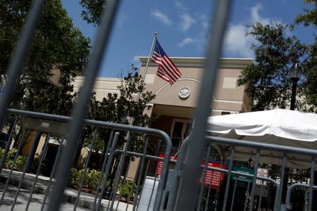 An American flag flies at ICE facilities as communities brace for a reported wave of ICE deportation raids in Miami