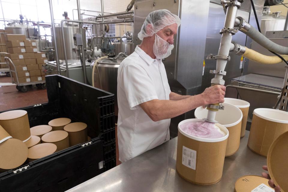 In this 2019 photo, Babcock Dairy plant employee Brad Jeglum fills 3 gallon containers of just made blueberry swirl ice cream on the UW-Madison campus. Babcock Dairy will create a new flavor to celebrate the university's 175th anniversary.



MARK HOFFMAN/MILWAUKEE JOURNAL SENTINEL