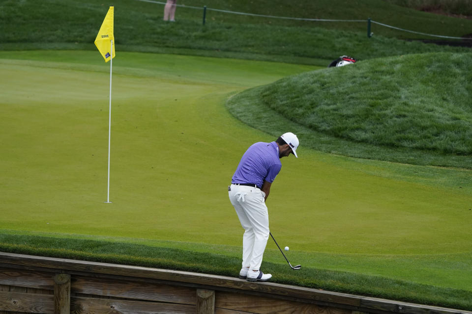 Abraham Ancer, of Mexico, chips to the 4th green during the first round of play in The Players Championship golf tournamnet Thursday, March 10, 2022, in Ponte Vedra Beach, Fla. (AP Photo/Lynne Sladky)