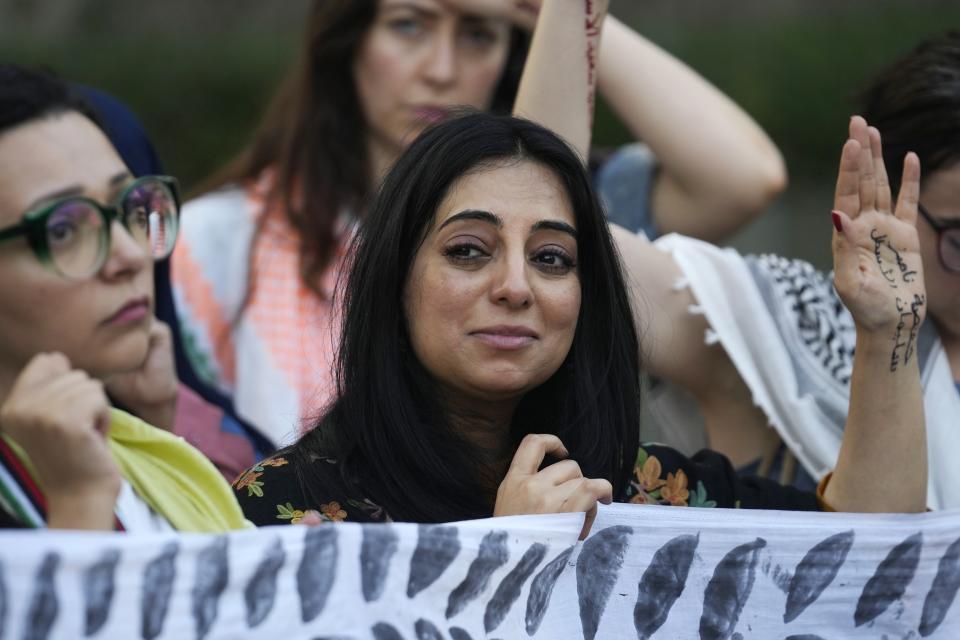 Demonstrators participate in a protest against the Israel-Hamas war during the COP28 U.N. Climate Summit, Wednesday, Dec. 6, 2023, in Dubai, United Arab Emirates. (AP Photo/Rafiq Maqbool)