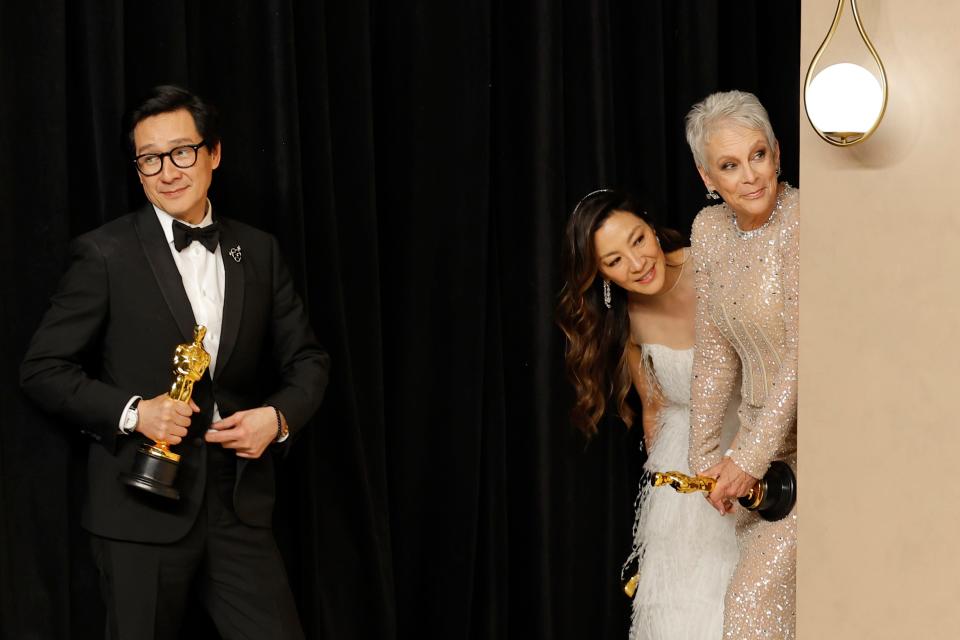Ke Huy Quan, winner of the Best Actor In A Supporting Role award, Michelle Yeoh, winner of the Best Actress in a Leading Role award and Jamie Lee Curtis, winner of the Best Supporting Actress award for "Everything Everywhere All at Once," pose in the press room during the 95th Annual Academy Awards in Hollywood, California.