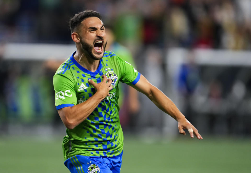 Seattle Sounders midfielder Cristian Roldan celebrates a goal against the LA Galaxy late in the second half of an MLS soccer match Wednesday, Oct. 4, 2023, in Seattle. (AP Photo/Lindsey Wasson)