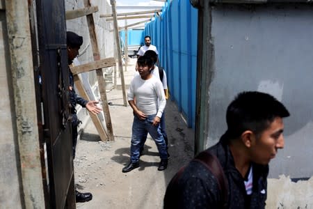 People deported from the United States leave an immigration center ahead of Sunday's presidential election in Guatemala City