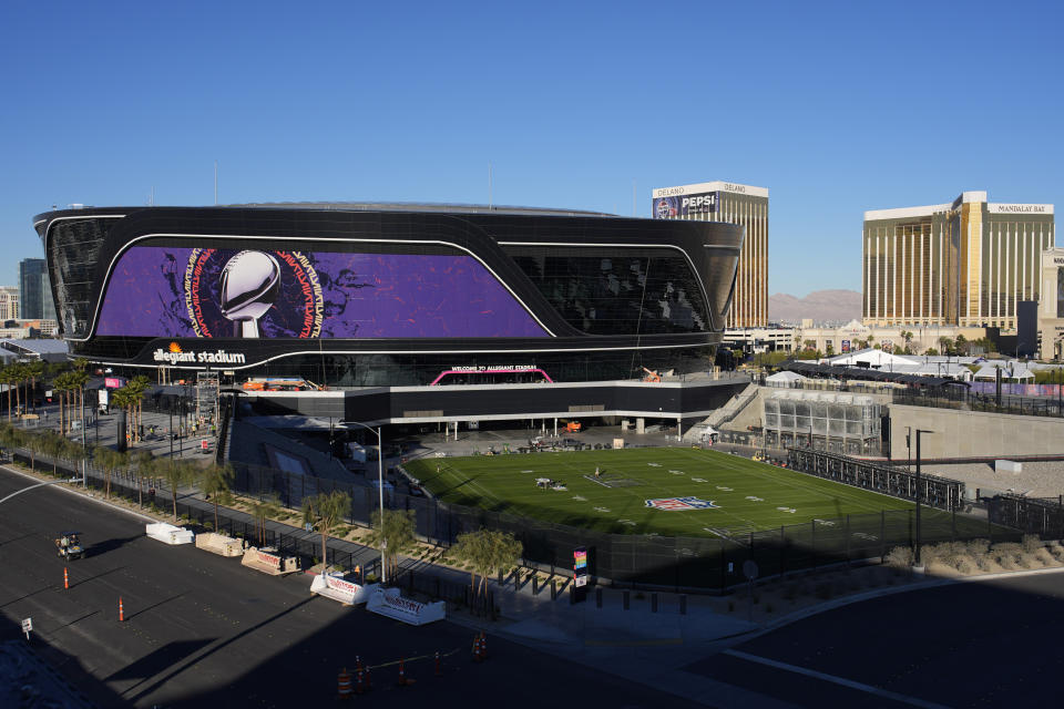 Workers prepare Allegiant Stadium ahead of the Super Bowl, Tuesday, Jan. 30, 2024, in Las Vegas. (AP Photo/John Locher)