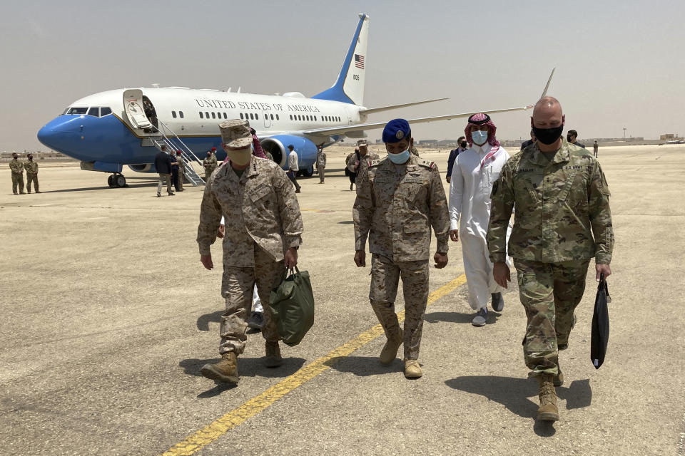 Marine Gen. Frank McKenzie, top U.S. commander for the Middle East, left, arrives in Riyadh, Saudi Arabia, on Sunday, May 23, 2201. “The Middle East writ broadly is an area of intense competition between the great powers. And I think that as we adjust our posture in the region, Russia and China will be looking very closely to see if a vacuum opens that they can exploit,” he says. (AP Photo/Lolita Baldor)