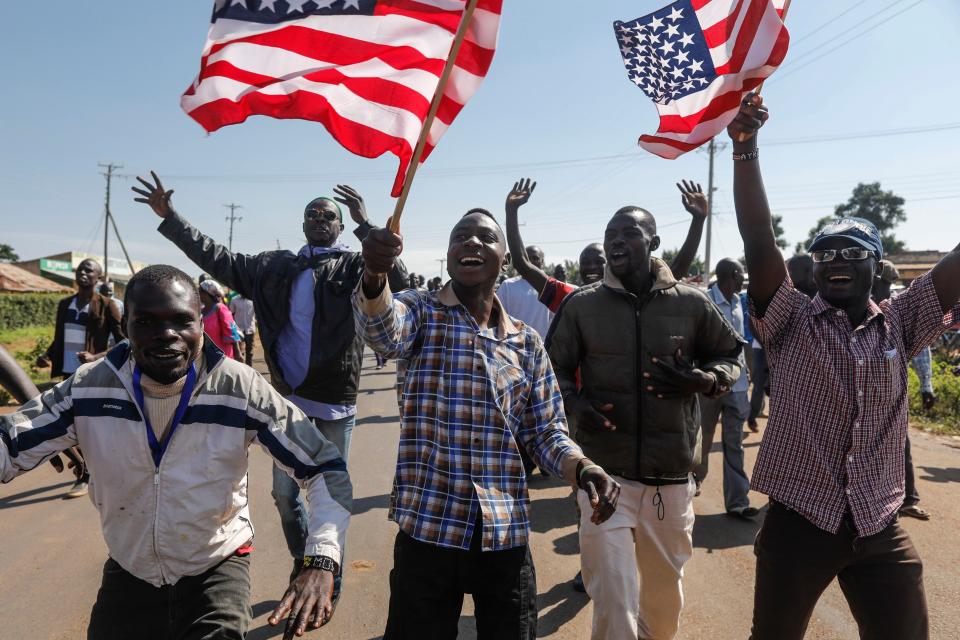 <p>Supporters of former US president Barack Obama wave US flags as they cheer to welcome Obama during an opening ceremony of the Sauti Kuu Sports, Vocational and Training Centre in his ancestral home Kogelo, some 400km west of the capital Nairobi, Kenya on July 16, 2018. (Photo: Dai Kurokawa/EPA-EFE/REX/Shutterstock) </p>