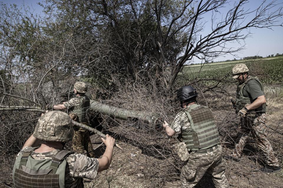 Ukrainian artillerymen in the military assembly center check the weapons and special equipment to make them ready before they go to their duties at the frontline in Kherson, Ukraine on July 15, 2022.