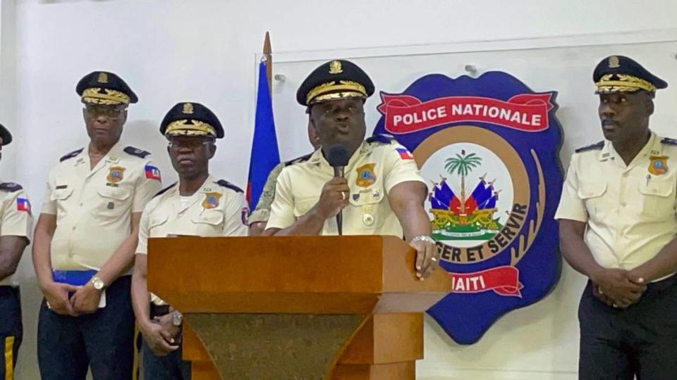 Frantz Elbé, center, was replaced Wednesday as Haiti’s top cop.