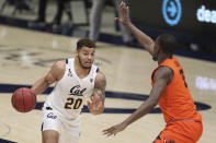 California forward Matt Bradley, left, drives to the basket against Oregon State forward Dearon Tucker during the second half of an NCAA college basketball game in Berkeley, Calif., Thursday, Feb. 25, 2021. (AP Photo/Jed Jacobsohn)