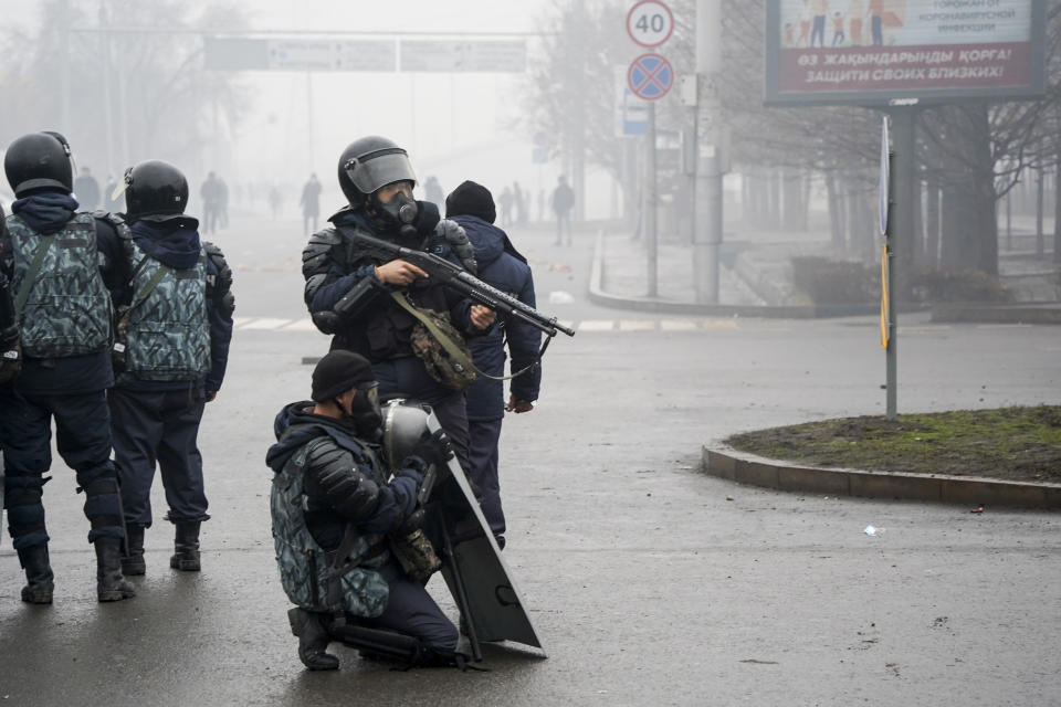 FILE - Riot police officers stand ready to stop demonstrators during a protest in Almaty, Kazakhstan, Jan. 5, 2022. On Jan. 2, small protests broke out in an oil city in western Kazakhstan where residents were unhappy about a sudden spike in prices for liquified gas, which is widely used as automotive fuel. By Jan. 5, the protests descended into violence, with armed groups storming government buildings and setting cars and buses on fire in Kazakhstan's largest city, Almaty. (Vladimir Tretyakov/NUR.KZ via AP, File)