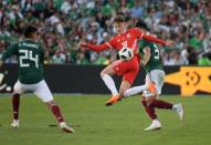 May 28, 2018; Pasadena, CA, USA; Wales midfielder David Brooks (18) battles for the ball with Mexico defender Edson Alvarez (24) and defender Carlos Salcedo (3) in the second half of an international friendly at the Rose Bowl. Kirby Lee-USA TODAY Sports