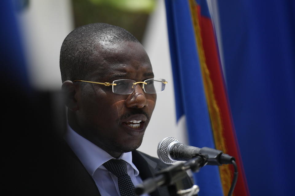 File - Then Interim Prime Minister Claude Joseph speaks during a memorial service for the late Haitian President Jovenel Moise, in Port-au-Prince, Haiti, July 20, 2021. Dominican President Luis Abinader signed an order on Wednesday, Sept. 7, 2022, that has barred Joseph, now an aspiring presidential candidate, from entering the country. (AP Photo/Matias Delacroix, File)