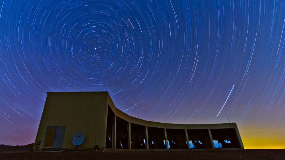 A telescope station in Utah, with stars swirling overhead. - Courtesy University of Utah