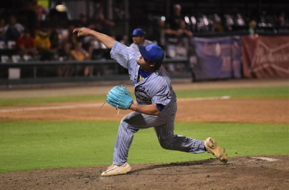 Dos Palos High School senoir Will Montemurro delivers a pitch against Kingsburg in the Central Section Division III championship game on Thursday, May 25, 2023 at Valley Strong Ballpark in Visalia, Calif.