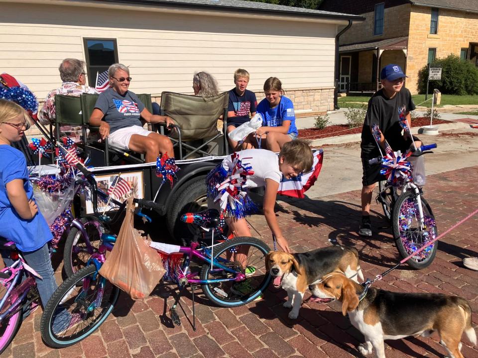 Russell Specialty Books and Gifts in Kansas has two bookstore beagles, Buddy and JJ. They're pictured here enjoying a Fourth of July parade.