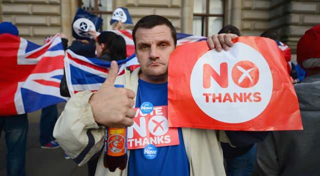 Unionist supporters gather where Yes activists had been holding a pre-referendum event in Glasgow. Photo: Getty Images