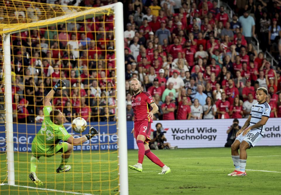 St. Louis City SC forward João Klauss watches as his shot slips past Sporting Kansas City goalkeeper Tim Melia for a goal during the second half of an MLS soccer match Saturday, Sept. 30, 2023, in St. Louis. (David Carson/St. Louis Post-Dispatch via AP)