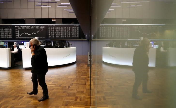 A trader at the Frankfurt stock exchange reacts on late afternoon trading results in Frankfurt, Germany, November 9, 2016. REUTERS/Kai Pfaffenbach/Files