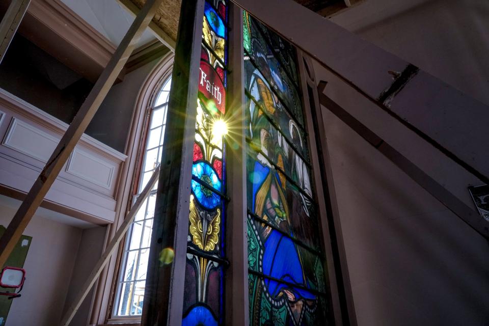 Light glints through the Gibbs-DeWolf stained glass, which was removed from its window frame during renovation of the former St. Mark's Church.