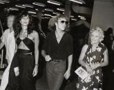 <p>Peter Frampton walks backstage at Madison Square Garden after a show in 1979. The musician is joined by his girlfriend, Barbara Gold, and his parents. </p>