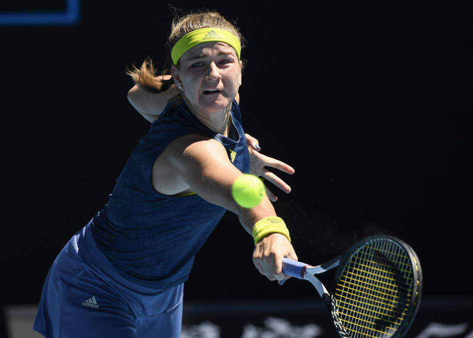 Karolina Muchova of the Czech Republic hits a backhand return to Australia's Ash Barty during their quarterfinal match at the Australian Open tennis championship in Melbourne, Australia, Wednesday, Feb. 17, 2021.(AP Photo/Andy Brownbill)