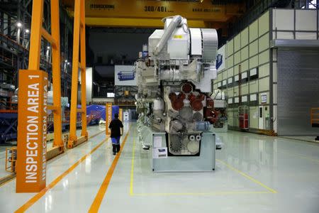 An employee walks at a engine factory of CSSC Wartsila Engine (Shanghai) Co. Ltd in Shanghai, China June 13, 2017. Picture taken June 13, 2017. REUTERS/Aly Song