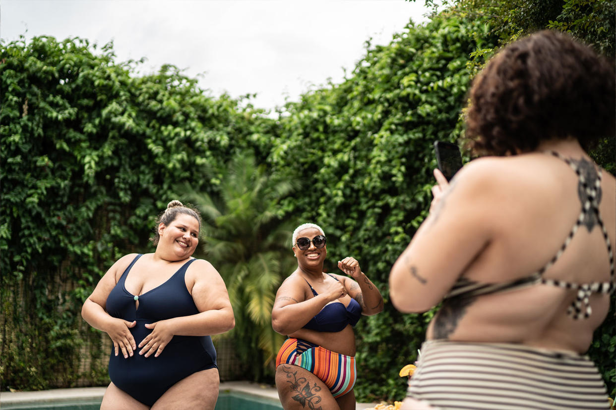 Women friends dancing bathing suits fat 1397346055 Getty Images/FG Trade