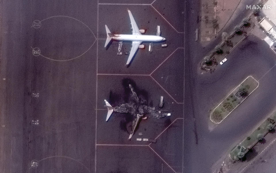 This satellite image provided by Maxar Technologies shows a destroyed Ukrainian airplane in Khartoum International Airport, Sudan, Monday April 17, 2023. The Sudanese military and a powerful paramilitary group are battling for control of the chaos-stricken nation for a third day. (Satellite image ©2023 Maxar Technologies via AP)