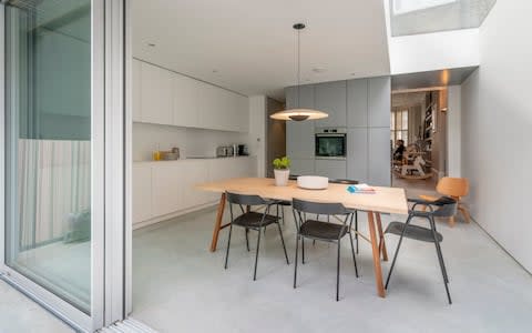 The minimalist kitchen of the home in Clapham. - Credit: Andrew Crowley