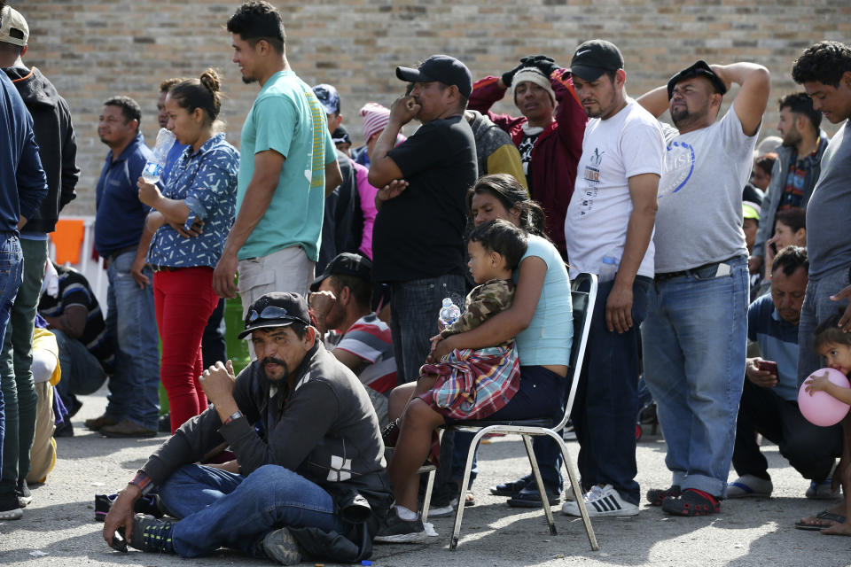 Central American immigrants line up to register with Mexican Immigration officials at a shelter in Piedras Negras, Mexico, Tuesday, Feb. 5, 2019. A caravan of about 1,600 Central American migrants camped Tuesday in the Mexican border city of Piedras Negras, just west of Eagle Pass, Texas. The governor of the northern state of Coahuila described the migrants as "asylum seekers," suggesting all had express intentions of surrendering to U.S. authorities. (Jerry Lara/The San Antonio Express-News via AP)