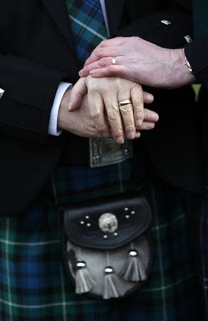 Larry Lamont and Jerry Slater (R) take part in a symbolic same-sex marriage outside the Scottish Parliament in Edinburgh, Scotland February 4, 2014. REUTERS/Russell Cheyne